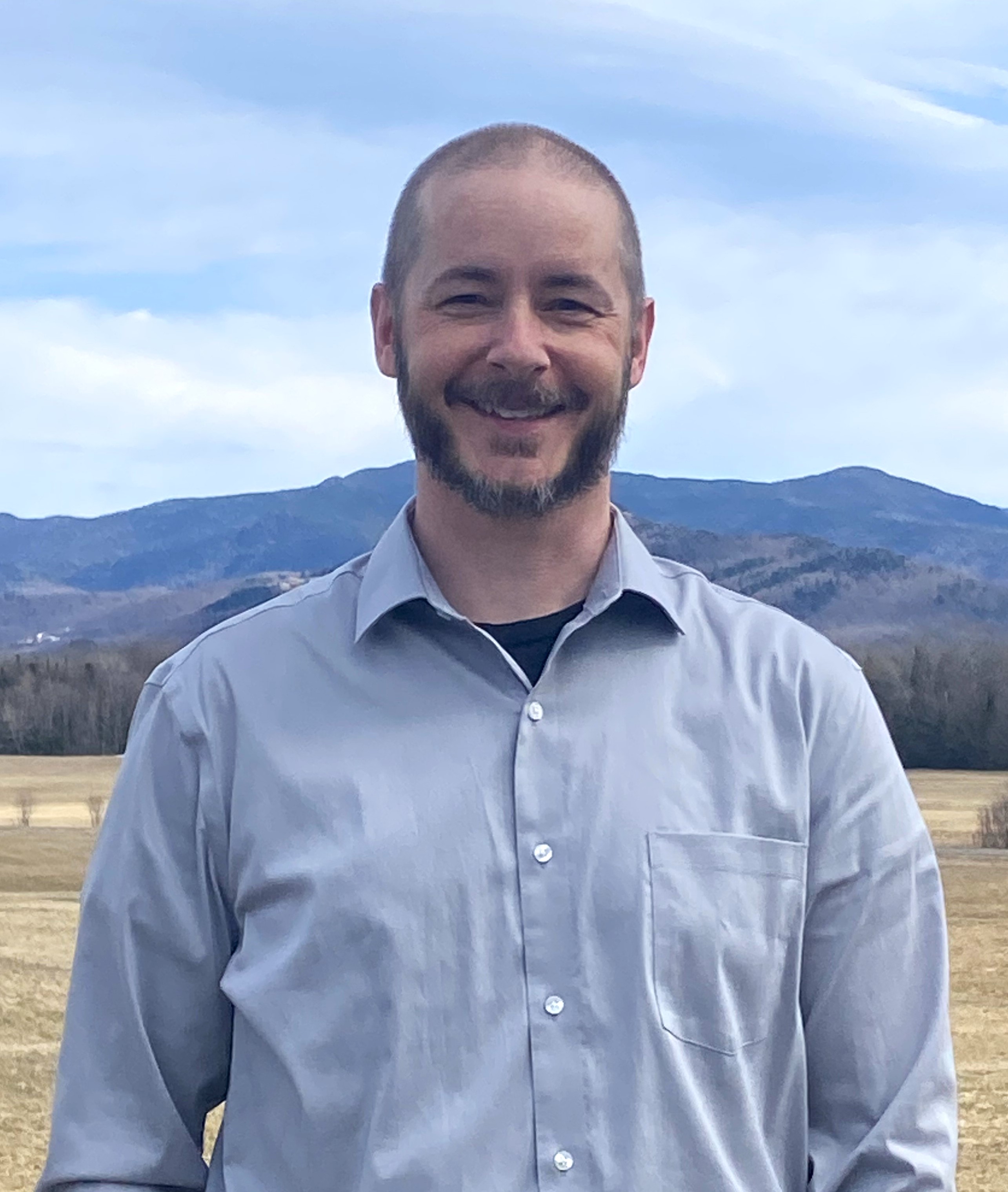 Man standing in front of mountain view